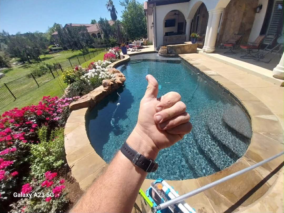 Pool with water feature serviced by The Pool Police — Four Points Austin