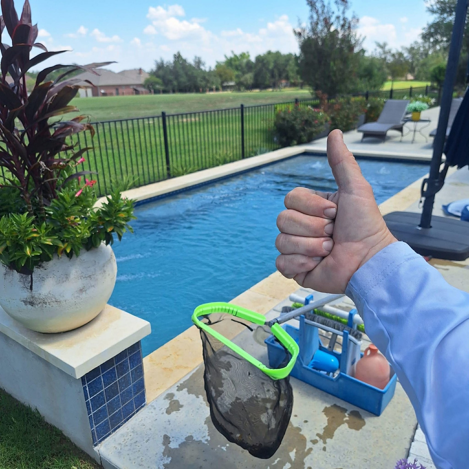 Sparkling clean pool maintained by The Pool Police — River Place Austin